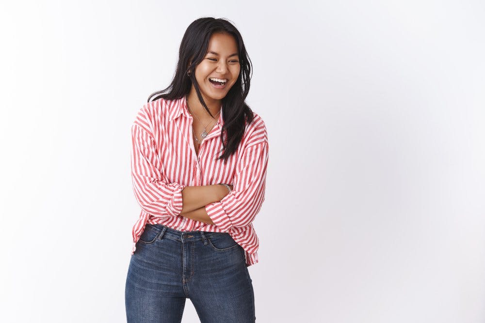 woman in striped shirt laughing