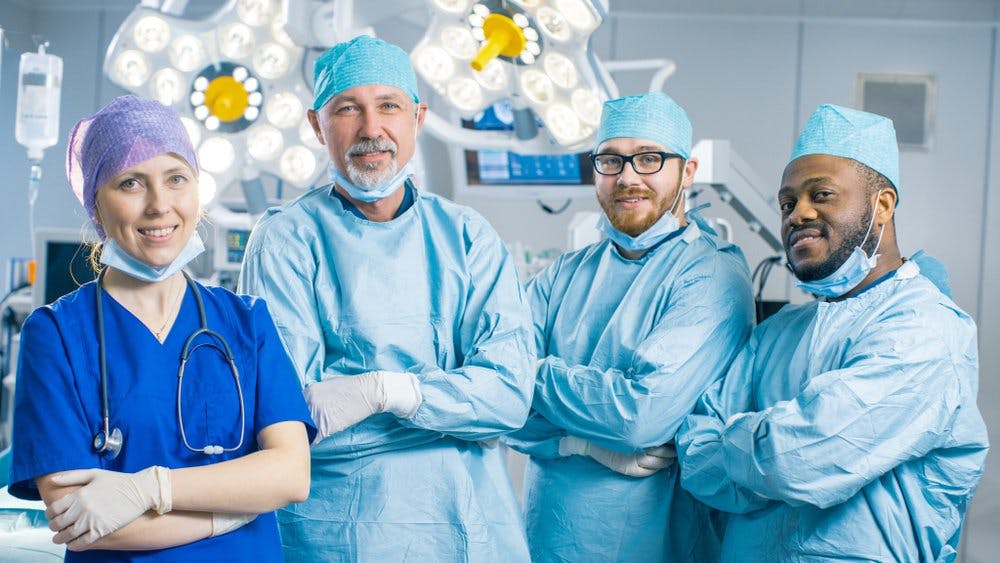 surgeons smile in operating theatre