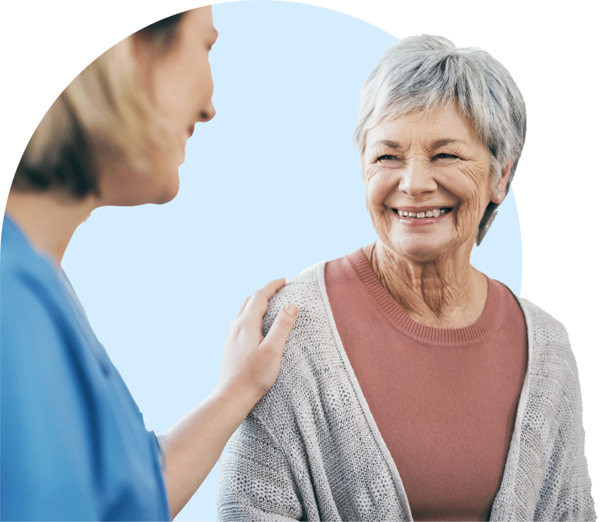 Caring hand placed on older woman's shoulder